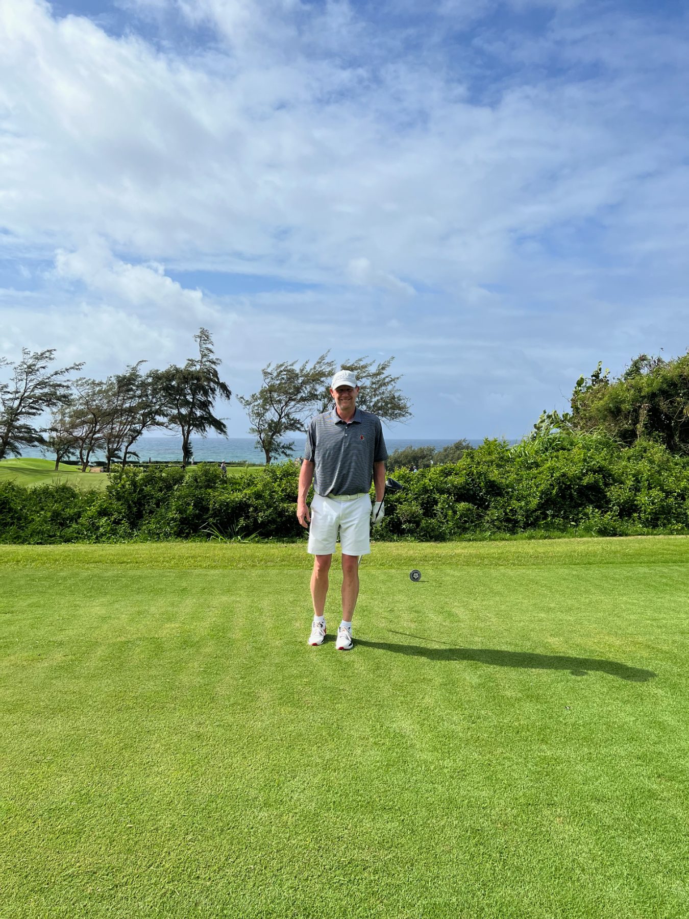 On the tee, ocean behind